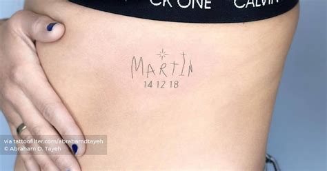 Name "Martin" and date tattooed on the rib.