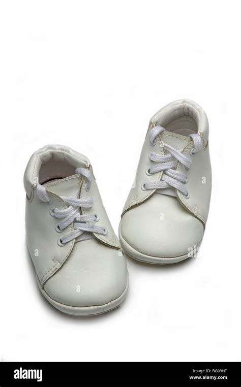 White baby shoes on white Stock Photo - Alamy