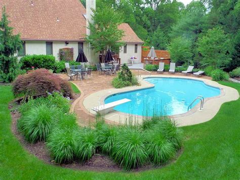 large green grassy bushes | Inground pool landscaping, Pool landscape design, Backyard pool ...