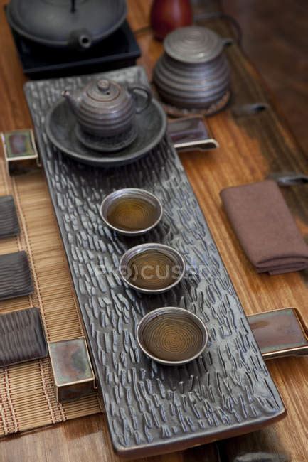 Classic chinese tea ceremony set on table — old fashioned, herbal tea - Stock Photo | #182380372