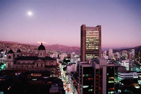 La Paz skyline with snow capped Mount Illimani at dusk. Bolivia's picturesque largest city is ...