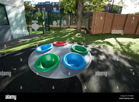 Sensory play equipment in a special school playground Stock Photo - Alamy