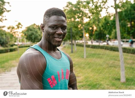 Athletic black man exercising at the park - a Royalty Free Stock Photo from Photocase