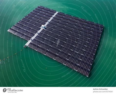 Aerial view of a solar park with solar panels in the water of a lake - a Royalty Free Stock ...