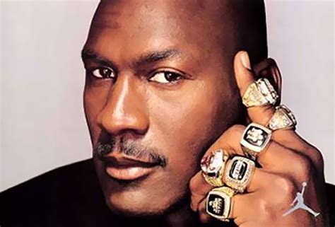 This picture of Michael Jordan with his rings can define many things, hard worker, humble ...