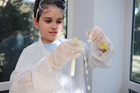 Inspired Schoolboy, Fascinated by Chemical Experiment while a Liquid ...