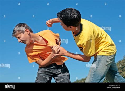 two teenage boys pretending to fight Stock Photo - Alamy