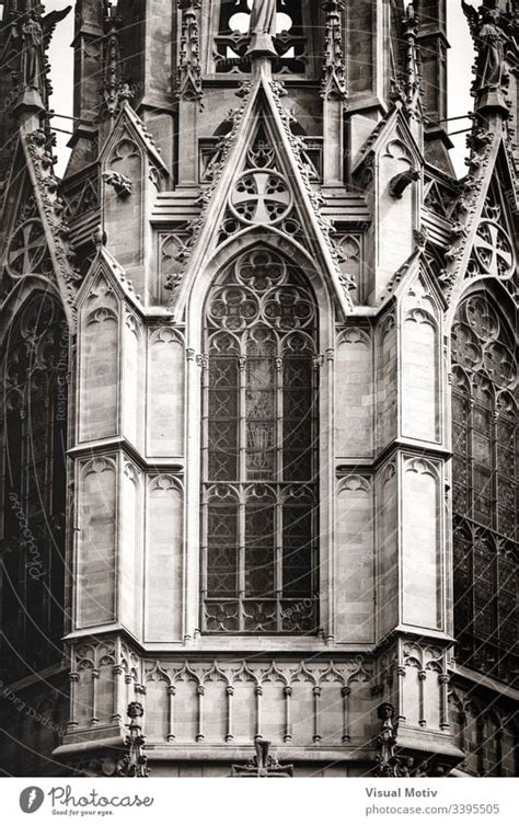 Sculpted filigrees of a gothic cathedral main tower in black and white ...