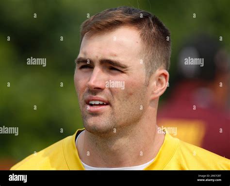 Washington Commanders quarterback Jake Fromm walks to the field before the beginning of an NFL ...