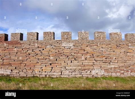 Defensive dry stone wall with crenellation of the Eketorp Castle, Iron ...