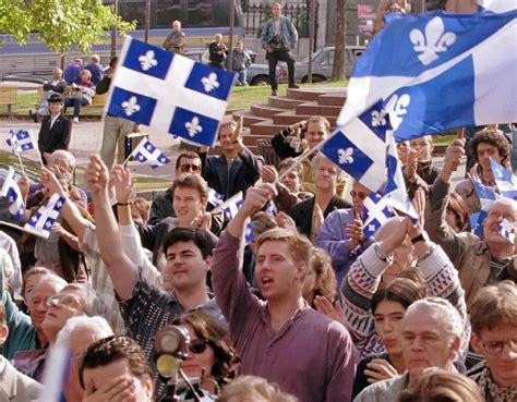 Quebec independence supporters wave the flag of Quebec during the 1995 ...