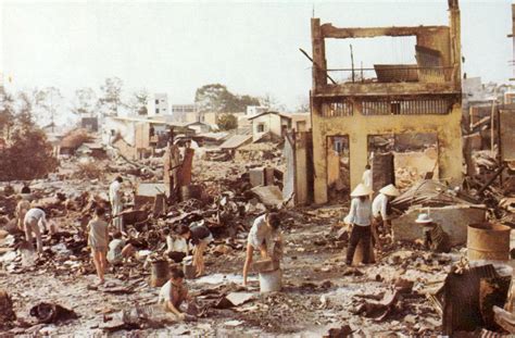 Civilians sort through the ruins of their homes in Cholon in the Vietnam War image - Free stock ...