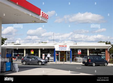 Esso petrol station with Tesco shop in Crewe UK Stock Photo, Royalty ...