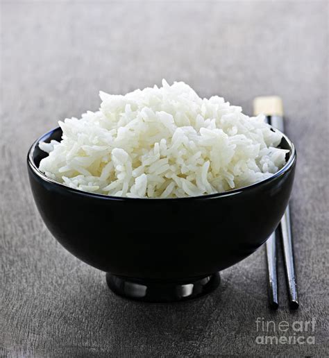 Bowl Of Rice With Chopsticks Photograph by Elena Elisseeva