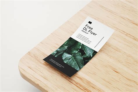 6 Mockups of DL Flyer on Wooden Table in Different Views and Positions (FREE) - Resource Boy