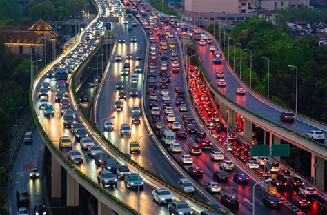 Traffic jam in the rush hour on highway. Cars on bridges and roads in Shanghai Downtown, China ...