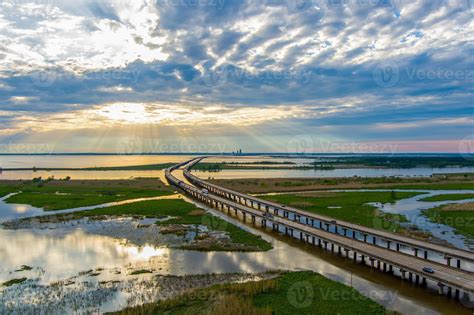 Aerial view of Mobile Bay and Jubilee Parkway bridge at sunset on the Alabama Gulf Coast ...