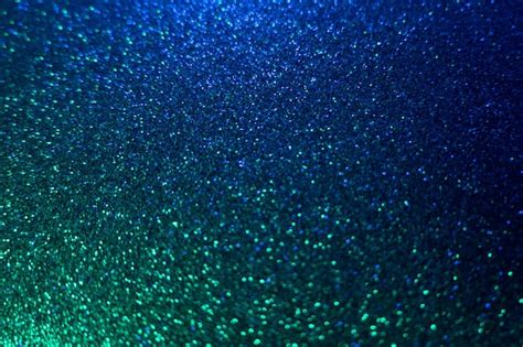 Premium Photo | Neon glitter background grain texture blue green