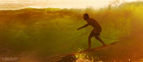 ClarkVision Photograph - Backlit Wave and Surfer at Sunset in Hawaii