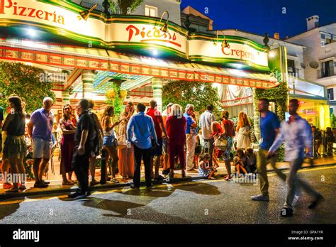 People waiting in line at Picasso Pizzeria at night, nightlife, Marina Puerto Banus, Marbella ...