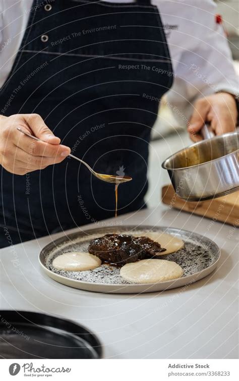 Chef preparing delicacy dish in restaurant kitchen - a Royalty Free ...