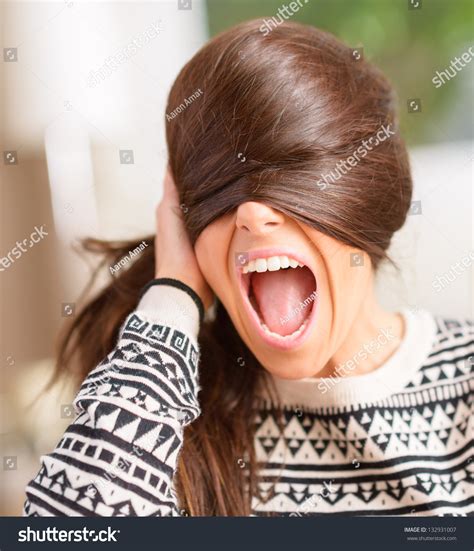 Angry Young Woman Hiding Face With Hair, Indoors Stock Photo 132931007 : Shutterstock