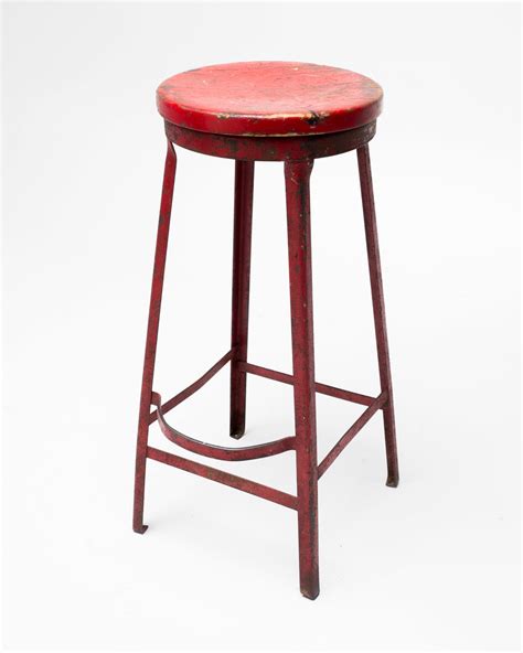 ST013 Oakley Distressed Red Metal Stool Prop Rental | ACME Brooklyn