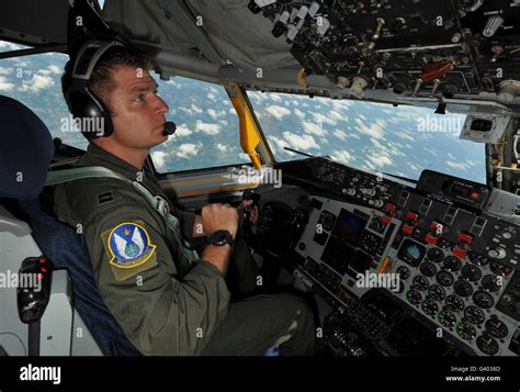 U.S. Air Force pilot checks the cockpit console of a KC-135 ...