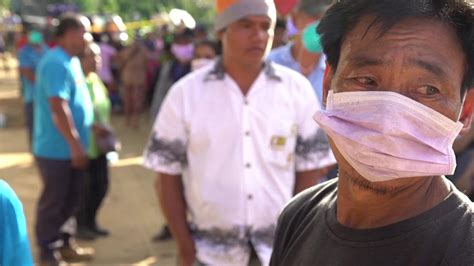 Families line up to identify landslide victims - CNN Video