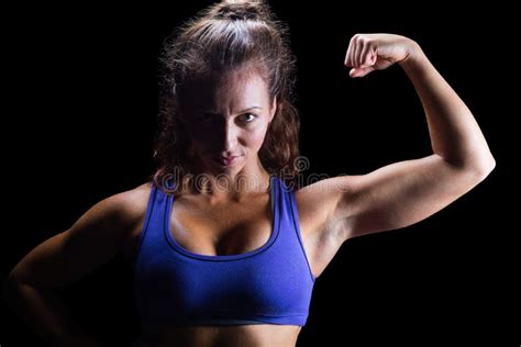 Portrait of Confident Female Athlete Flexing Muscles Stock Photo ...