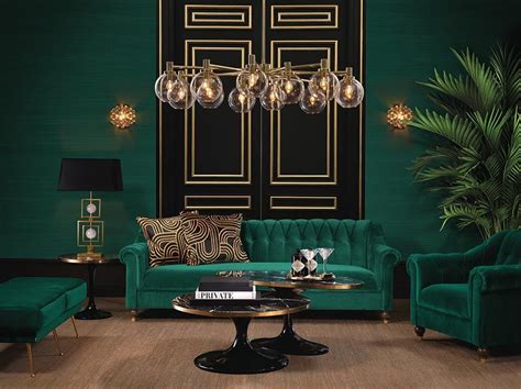 A luxurious sitting room with dark green walls and dark green velvet ...