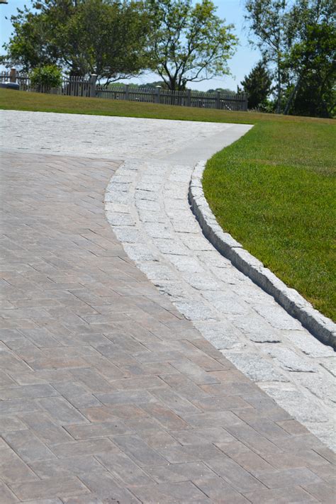 Driveway edging. Gray cobblestones line this vast driveway. | Driveway ...