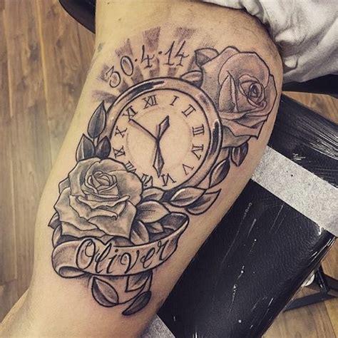 a tattoo on the leg of a person with a clock and roses