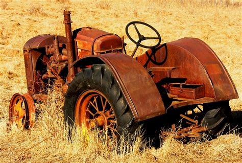 Rusty Tractor | This old rusty tractor is next to an unimpro… | Flickr