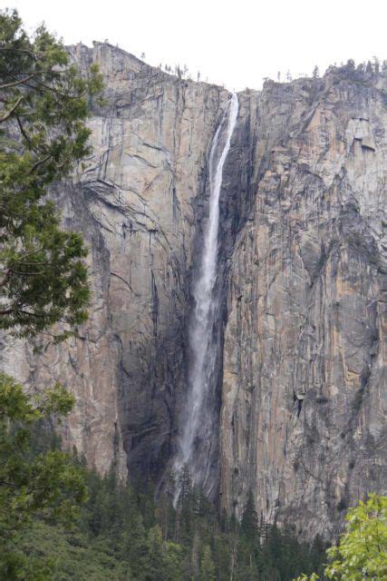 the waterfall is high up on the side of the mountain in yose falls ...