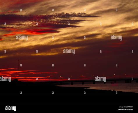 red sunset at the beach Stock Photo - Alamy