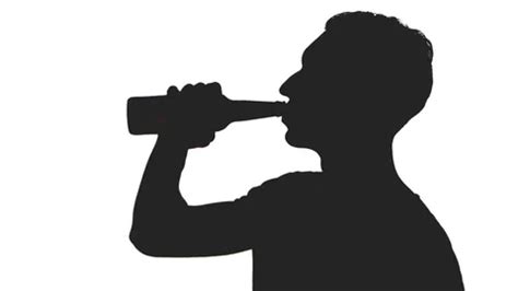 silhouette of a young man drinking beer ... | Stock Video | Pond5