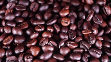 Freshly roasted coffee beans close up 20519042 Stock Video at Vecteezy