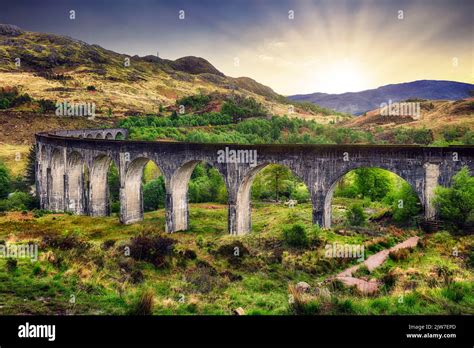 Scotland landscape - Glenfinnan train Viaduct at dramatic sunset with sun, UK Stock Photo - Alamy