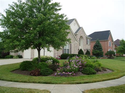 Brick Exterior Large Corner Lot with beautiful landscaping Back of House with large dec ...