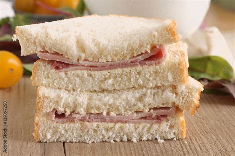 Ham Sandwich hand cut with crusty bread and plain ham Stock Photo | Adobe Stock