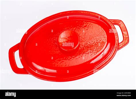 Red ceramic cast iron casserole dish. Studio Photo Stock Photo - Alamy