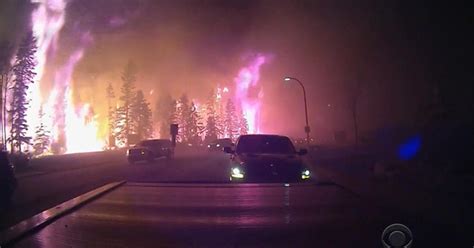 Wildfire drives massive evacuation in Alberta, Canada - CBS News