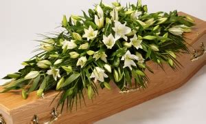 White Lily and Foliage casket spray | Brodies Blooms and Gifts