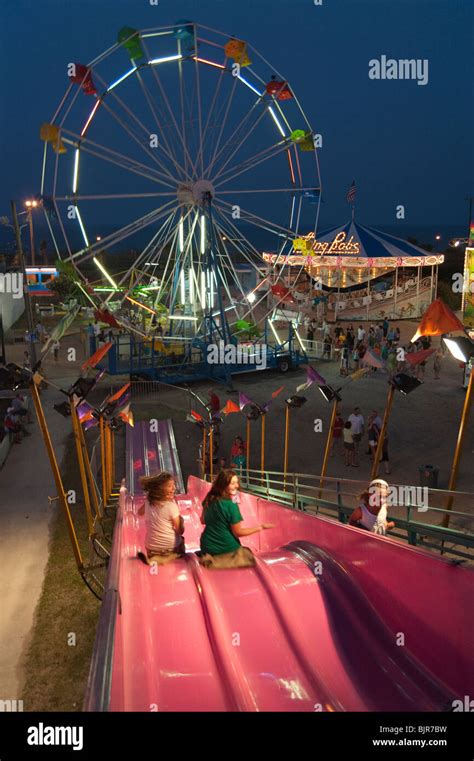 Children taking rides at Carolina Beach Boardwalk Amusement Park, North Carolina, USA Stock ...