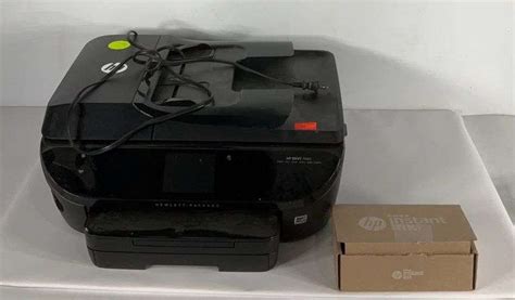 Hp Envy printer powers on. Comes with a new black ink cartridge - Hash Auctions