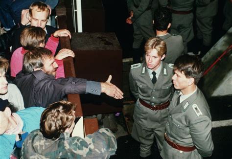 East German border guards refusing to shake hands at Checkpoint Charlie ...