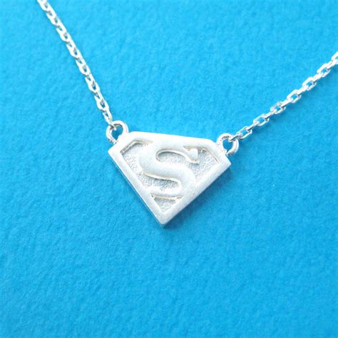 Superman Logo Symbol Charm Necklace in Silver · DOTOLY Animal Jewelry · The Animal Wrap Rings ...