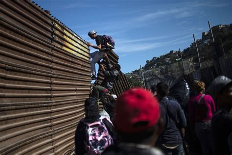 Migrants in Tijuana Run to U.S. Border, but Fall Back in Face of Tear Gas - The New York Times