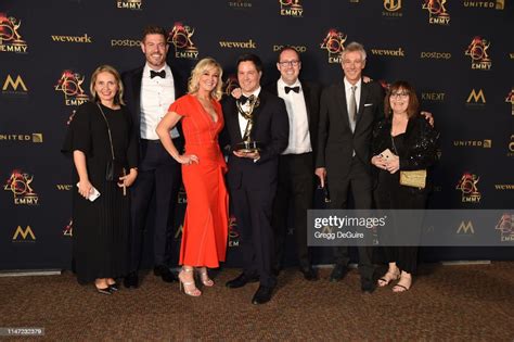 Cast and crew from Daily Mail TV pose with the Daytime Emmy Award for ...